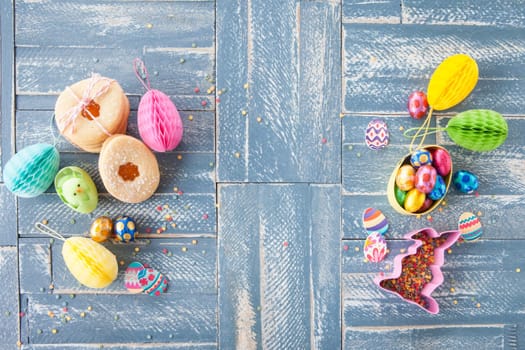 Colorful sweets at Easter on a rustic wooden background