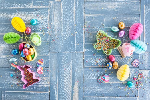 Colorful sweets at Easter on a rustic wooden background