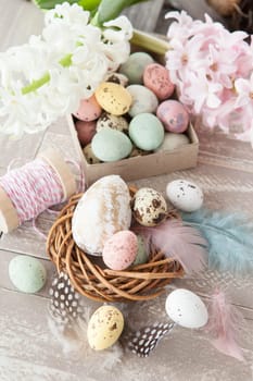 Colorful Easter decoration on a rustic wooden background