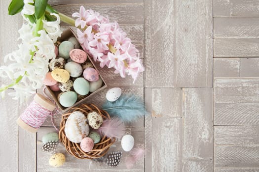 Colorful Easter decoration on a rustic wooden background