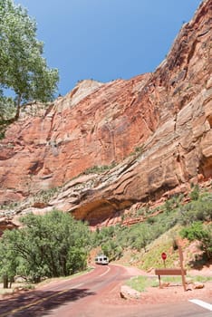 Springdale, Utah, USA - June 3, 2015: Zion Park Bus transports tourists inside the park at the Lodge. Zion National Park, Utah.