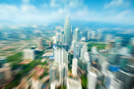 Zoom Kuala Lumpur city Malaysia, daytime blue sky.
