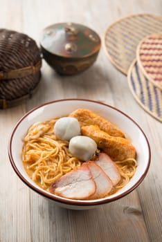Hot and spicy curry noodle on the table. One of the popular foods in Asia.