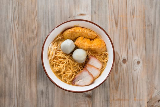 Top view Curry Laksa, which is a popular traditional spicy noodle soup from the culture in Malaysia.