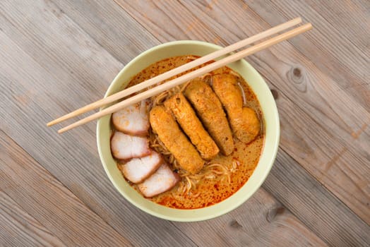 Top view Curry laksa, a popular spicy dish in Malaysia cuisine.