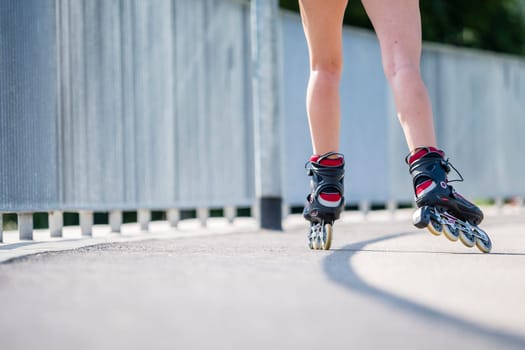 Woman,20 years old,inline skating,detailed shot skates and legs