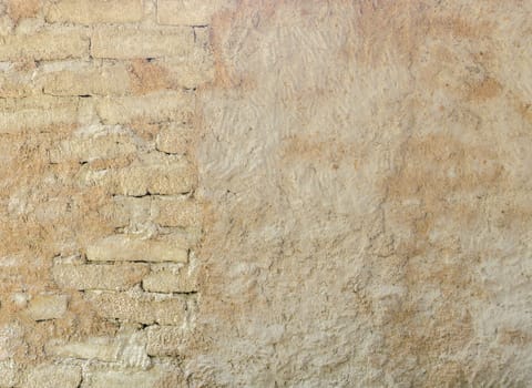 Natural wall texture of cob house for background. It is a natural building material made from subsoil, water and straw fibrous organic material.