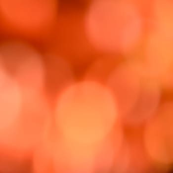 Orange bokeh abstract background of de-focused Christmas lights