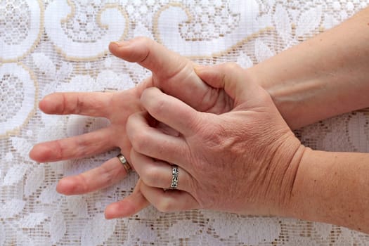 Strongly trembling hands in seniors. In a woman with Parkinson's,the hands tremble