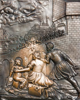 Bronze relief on the base of the statue of John Nepomuk on Charles Bridge - scene from the life of St. John of Nepomuk