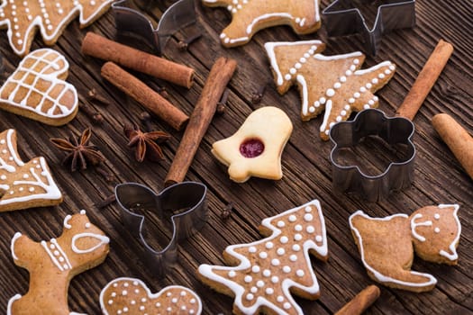 Christmas homemade gingerbread cookies on wooden background