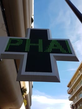 French Pharmacy Green Cross Sign or Drug Store Symbol