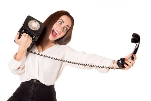 Casual young woman taking a selfie with an old phone isolated in a white background