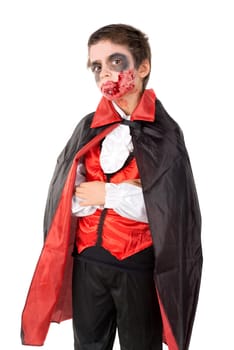 Boy with face-paint and vampire Halloween costume isolated in white