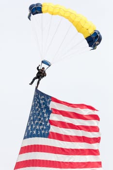 USA, Chicago - August 19: Sky diver perform at Chicago Air and Water shows presenting the American flag on August 19, 2017
