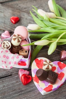 Heart box with chocolate and fresh flowers