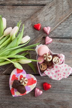 Heart box with chocolate and fresh flowers