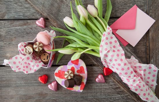 Heart box with chocolate and fresh flowers