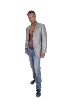 A handsome African American man standing, wearing a jacket and no.shirt, looking serious, isolated for white background.