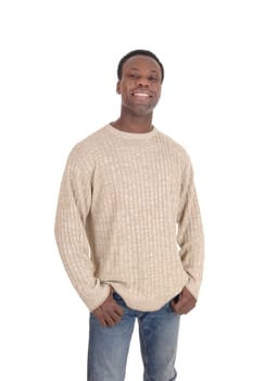 A young happy African American man in a beige sweater and jeans.standing smiling isolated for white background.