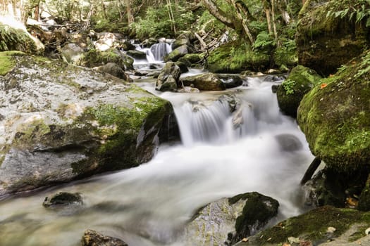 The soft water of a waterfall in the French Alps