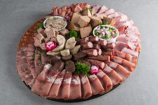 Assortment of meat delicatessen on a plate