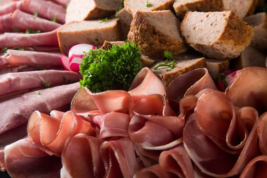Assortment of meat delicatessen on a plate
