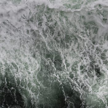 Big water splash seen from above a boat