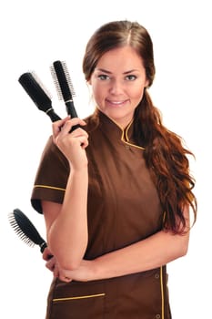 Professional hairdresser holding brushes