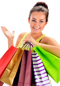 Young woman with paper shopping bags isolated on white background