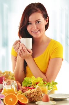 Young woman having breakfast. Balanced diet