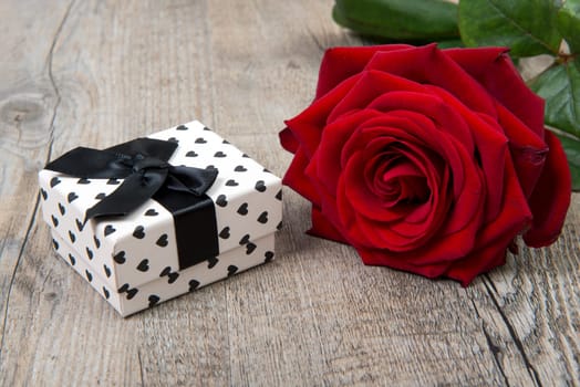 a rose and a gift for Valentine's Day