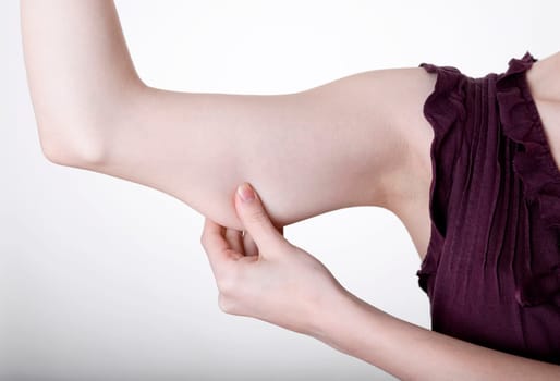 Hand pinches in upper arm