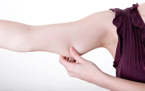 Hand pinches in upper arm