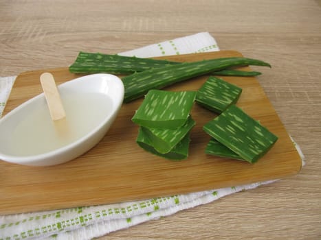 Aloe vera leaves and aloe vera gel in a bowl