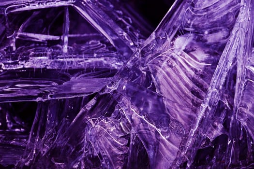 Close-up of frozen water in ultra violet. Abstract ice on a lake