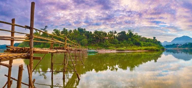 Beautiful view of a bamboo bridge. Luang Prabang. Laos landscape. Panorama