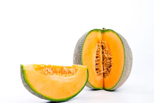 fresh sweet cantaloupe melon on white ground