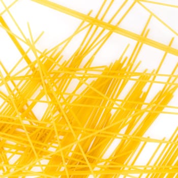 Spaghetti, yellow pasta ready for cooking. Isolated on the white background.