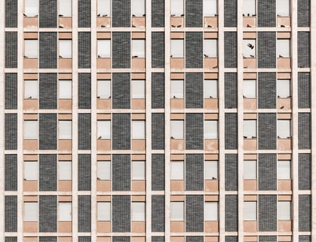 Background of vintage residential building windows invaded by pigeon
