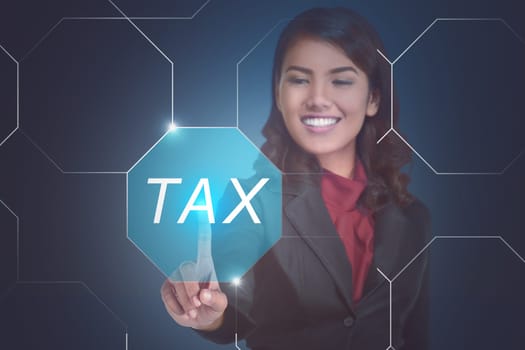 Young asian business woman choosing TAX on virtual touch screen on blue background