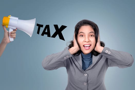 Asian business woman close her ears from megaphone with tax text against bright background
