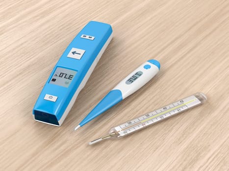 Different types of medical thermometers on wood background