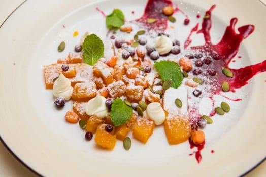 Tasty dessert from pumpkin sea-buckthorn lingonberry pumpkin seed and meat