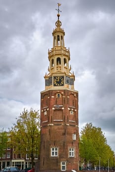 Tower (Montelbaanstoren) on Bank of the Canal Oudeschans in Amsterdam, Netherlands