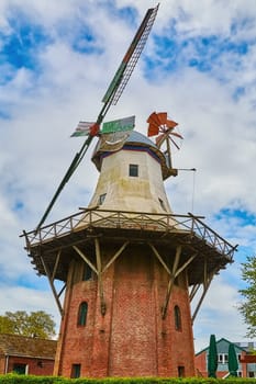 A Windmill under the Cloudy Sky