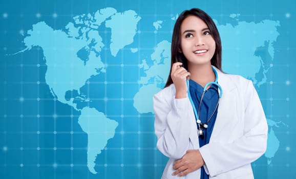 Cheerful asian female doctor with stethoscope on modern background