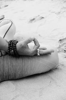 yoga lotus position on beach background copy space  calm relaxed beach wave