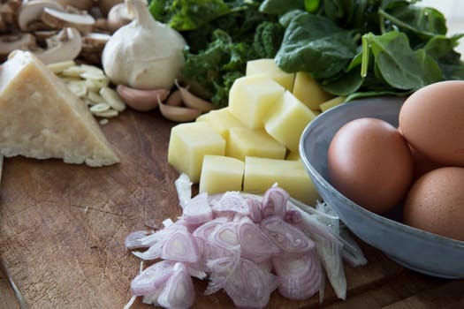 Fresh sliced shallots with eggs, potatoes and fresh parmesan.