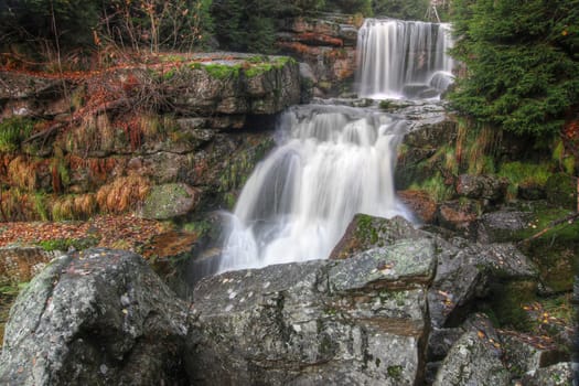 Waterfalls in the autumn forest - Jedlova waterfall in the Jizera Mountains, Czech republic